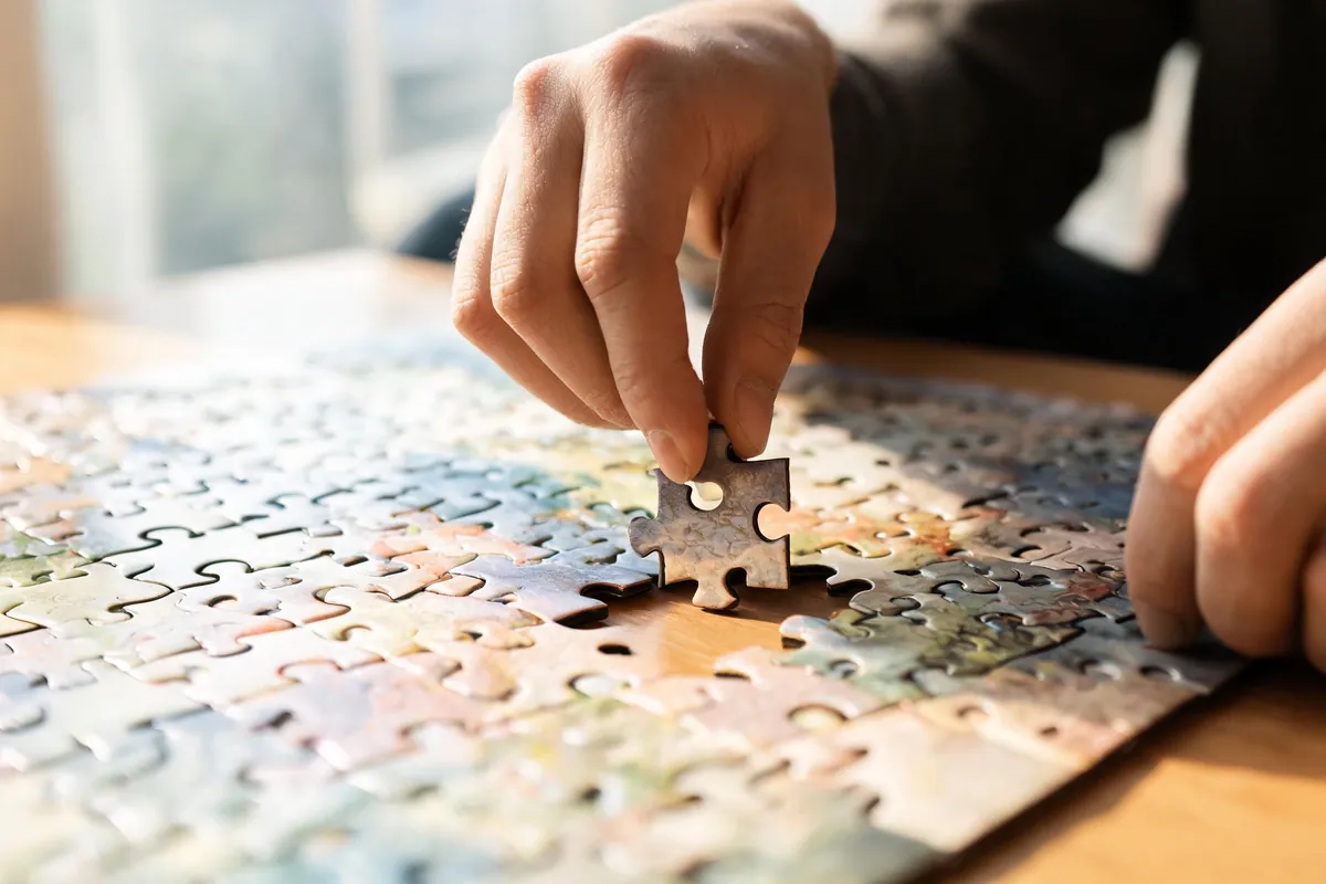 Senior working on a puzzle or crossword to keep the mind sharp - supporting image